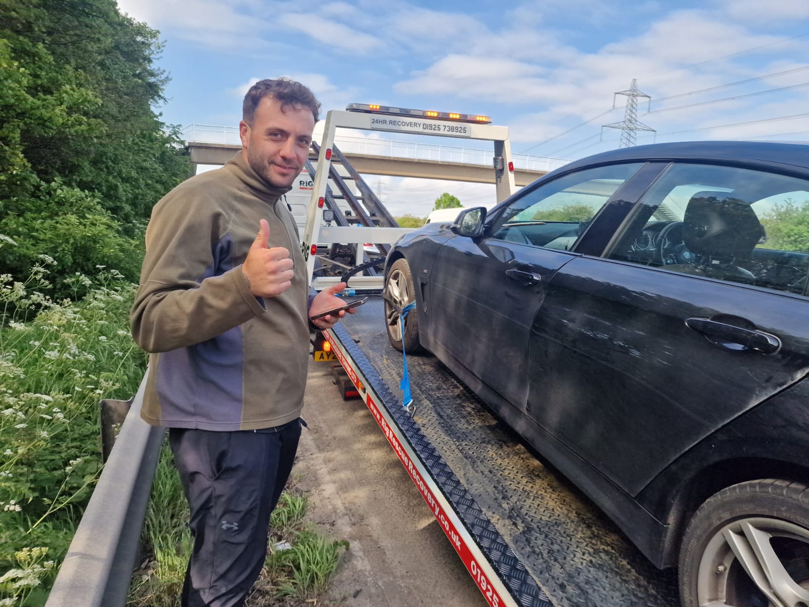 Simon strapping a Honda CR-V to the recovery truck for a roadside recovery.