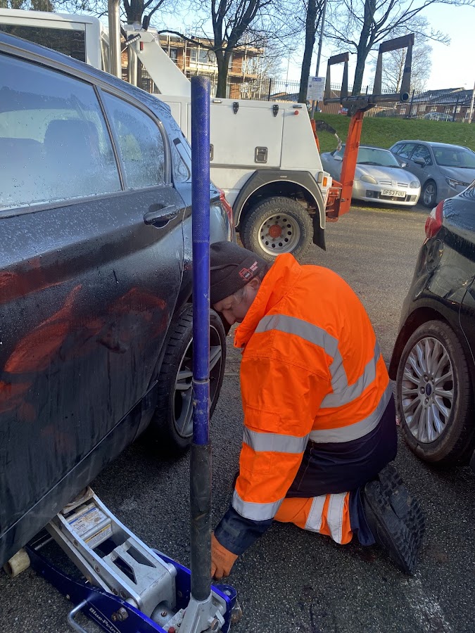 Simon swapping a wheel for a customer in a Liverpool car park &mdash; mobile tyre call-out.